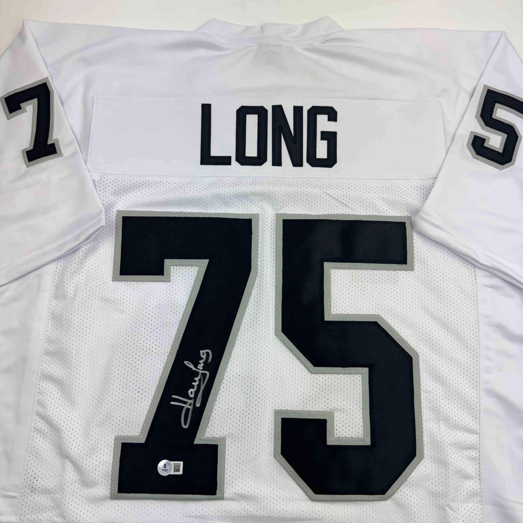 Autographed/Signed Howie Long Oakland White Football Jersey Beckett BAS COA