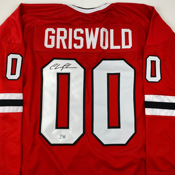 Autographed/Signed Chevy Chase Clark Griswold Vacation Red Jersey BAS COA