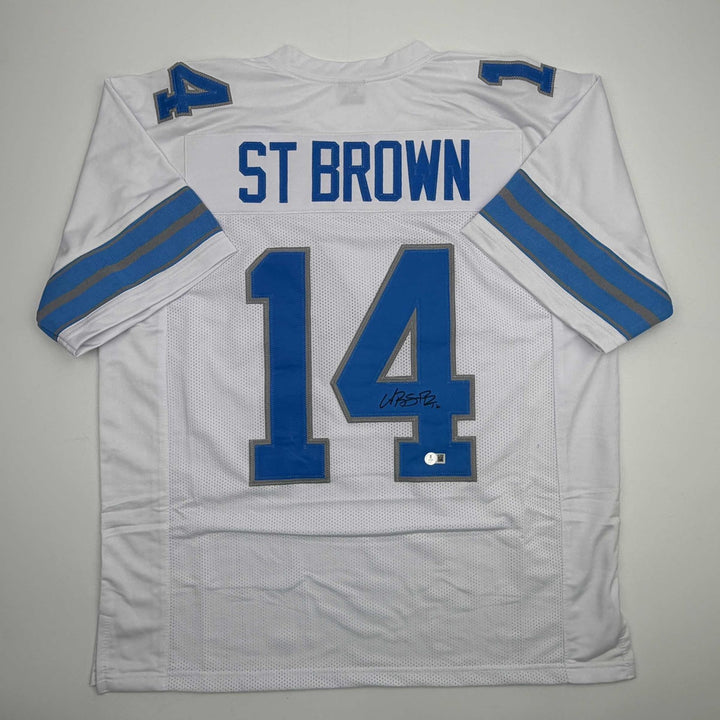 Autographed/Signed Amon-Ra St. Brown Detroit White Jersey Beckett BAS COA