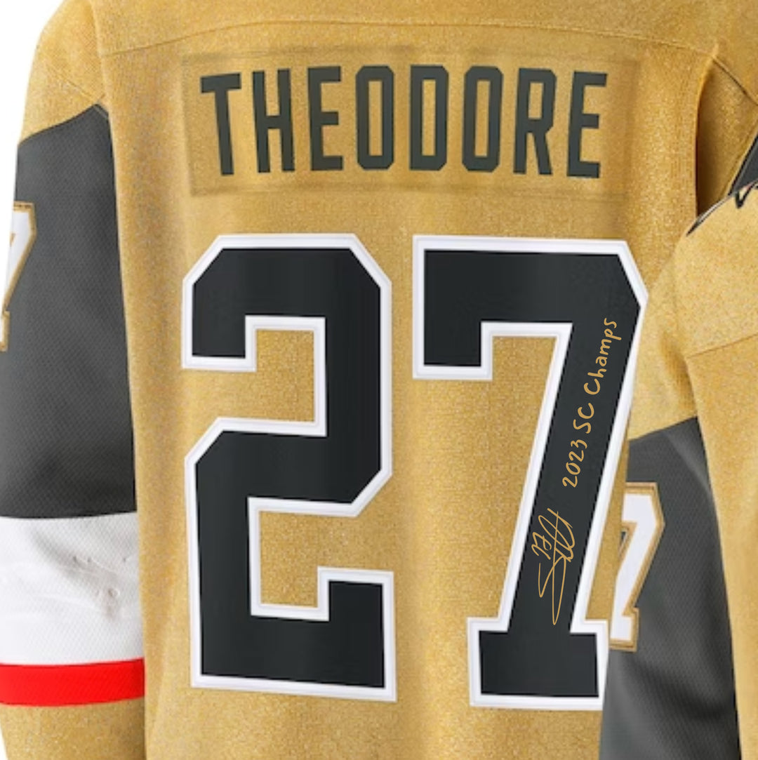 Shea Theodore Signed Vegas Golden Knights Gold Jersey Inscribed Champs IGM COA