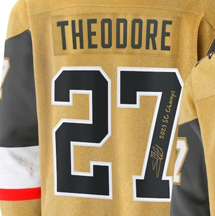 Shea Theodore Signed Vegas Golden Knights Gold Jersey Inscribed Champs IGM COA