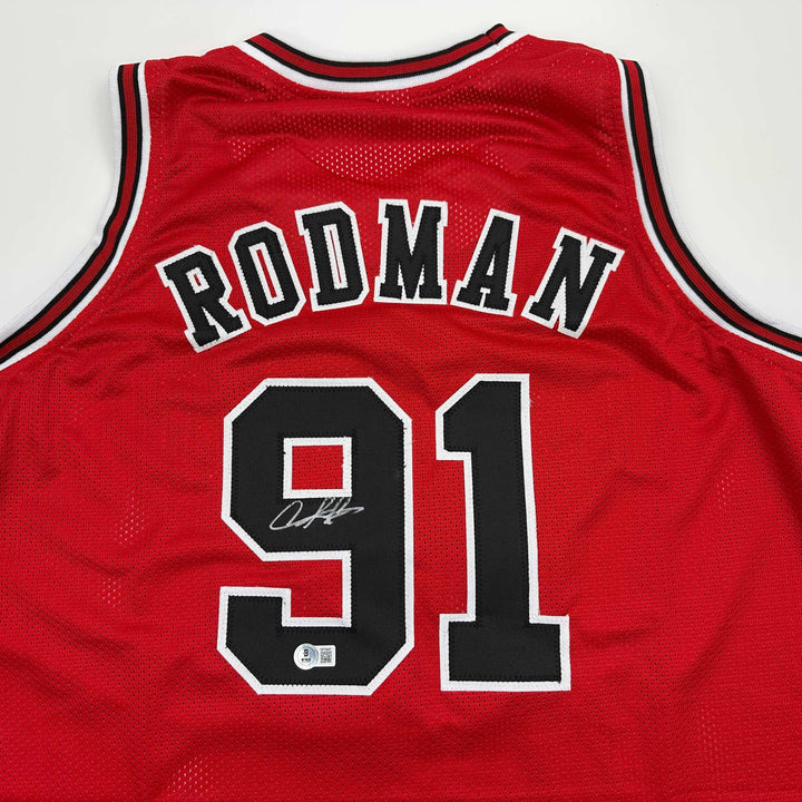 Autographed/Signed DENNIS RODMAN Chicago Red Basketball Jersey Beckett BAS COA