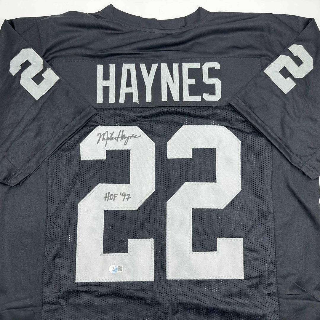 Autographed/Signed Michael Haynes HOF 97 Oakland Black Jersey Beckett COA