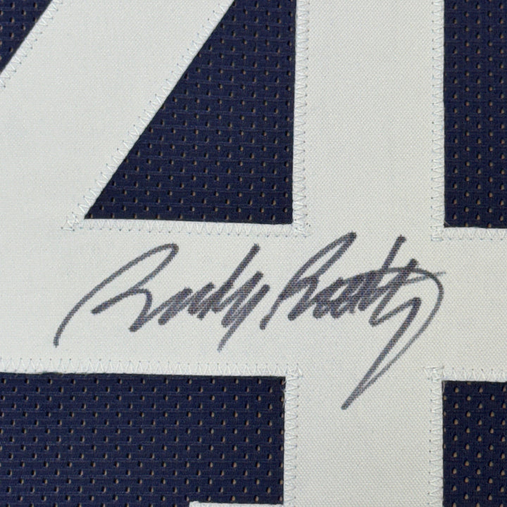 Framed Autographed/Signed Rudy Ruettiger 35x39 Never Quit ND Blue Jersey JSA COA