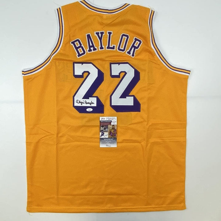 Autographed/Signed ELGIN BAYLOR Los Angeles Yellow Jersey JSA COA