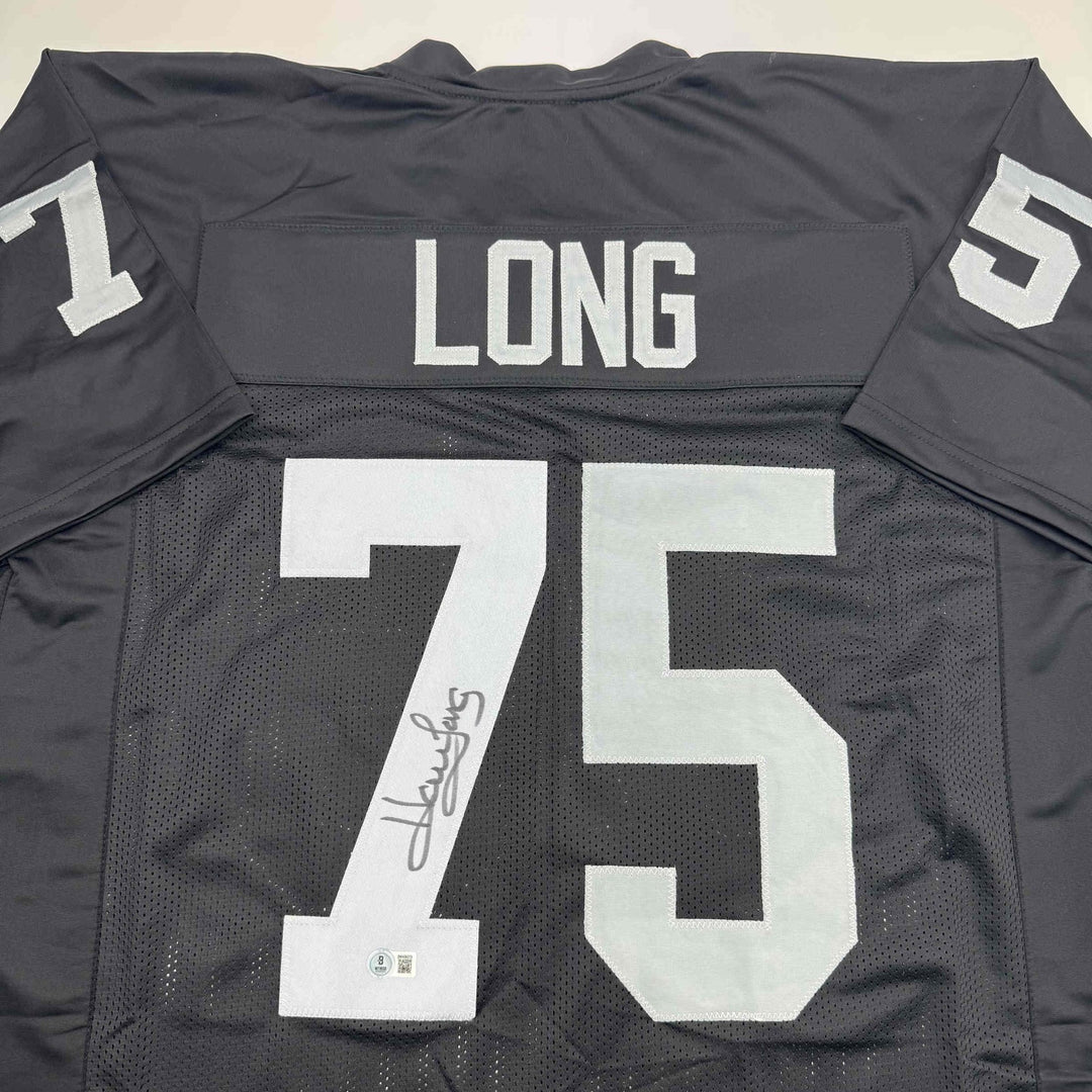 Autographed/Signed Howie Long Oakland White Football Jersey Beckett BAS COA