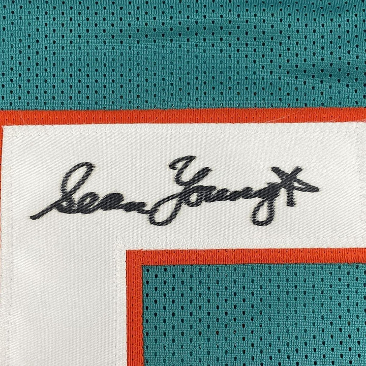 Signed SEAN YOUNG Ray Finkle Ace Ventura Miami Teal Jersey PSA COA