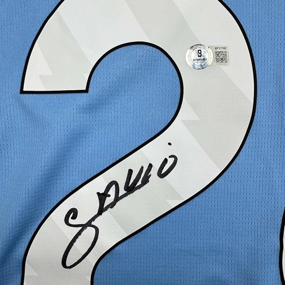 Framed Autographed/Signed Savinho 35x39 Manchester City Blue Jersey Beckett COA