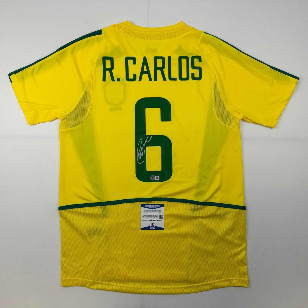 Autographed/Signed Roberto Carlos Brazil Yellow Jersey Beckett BAS COA