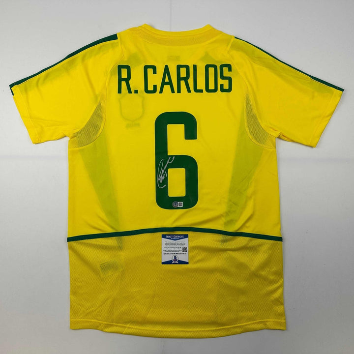Autographed/Signed Roberto Carlos Brazil Yellow Jersey Beckett BAS COA