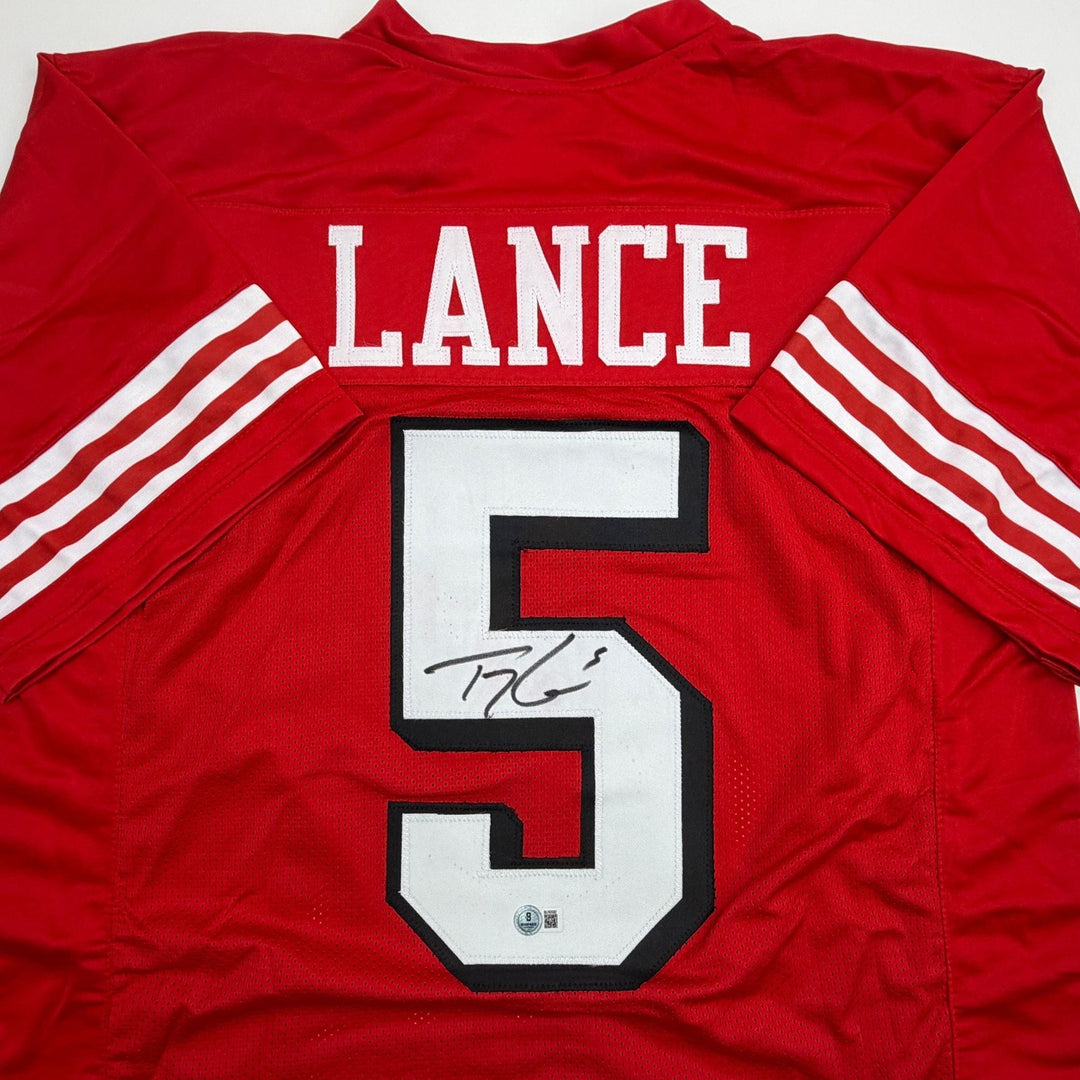 Autographed/Signed Trey Lance San Francisco Red ALT Jersey Beckett BAS COA