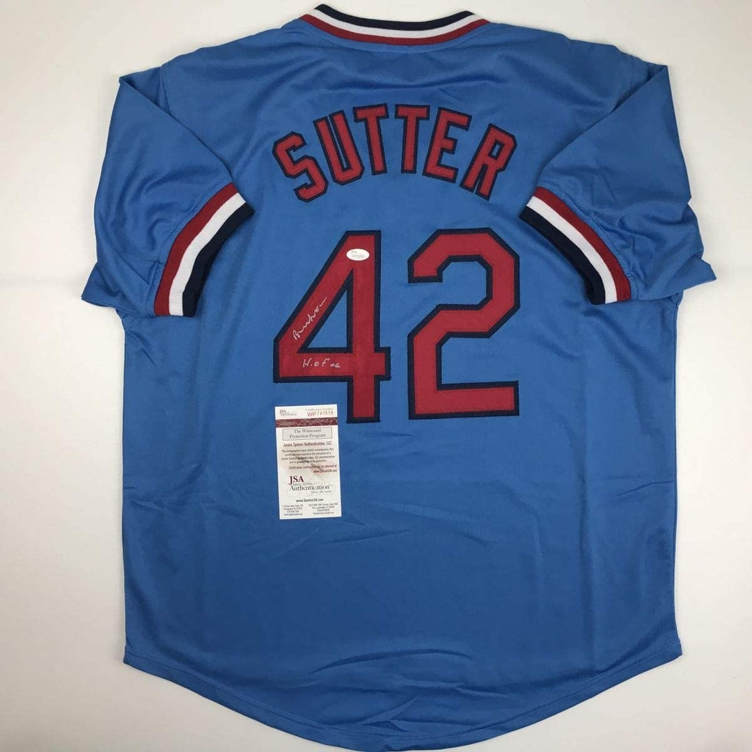 Autographed/Signed Bruce Sutter HOF 06 St. Louis Blue Jersey JSA COA