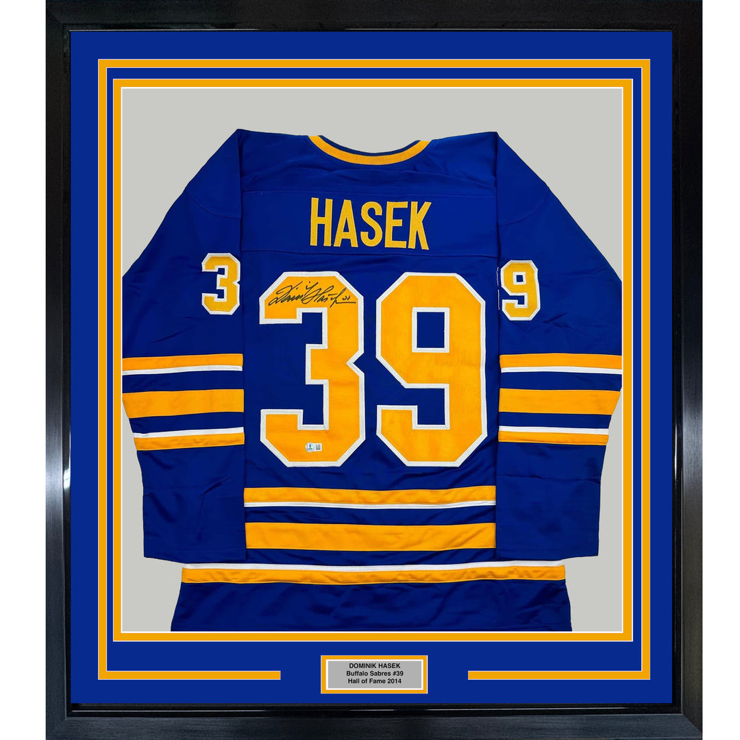 Framed Autographed/Signed Dominik Hasek 35x39 Buffalo Blue Hockey Jersey BAS COA