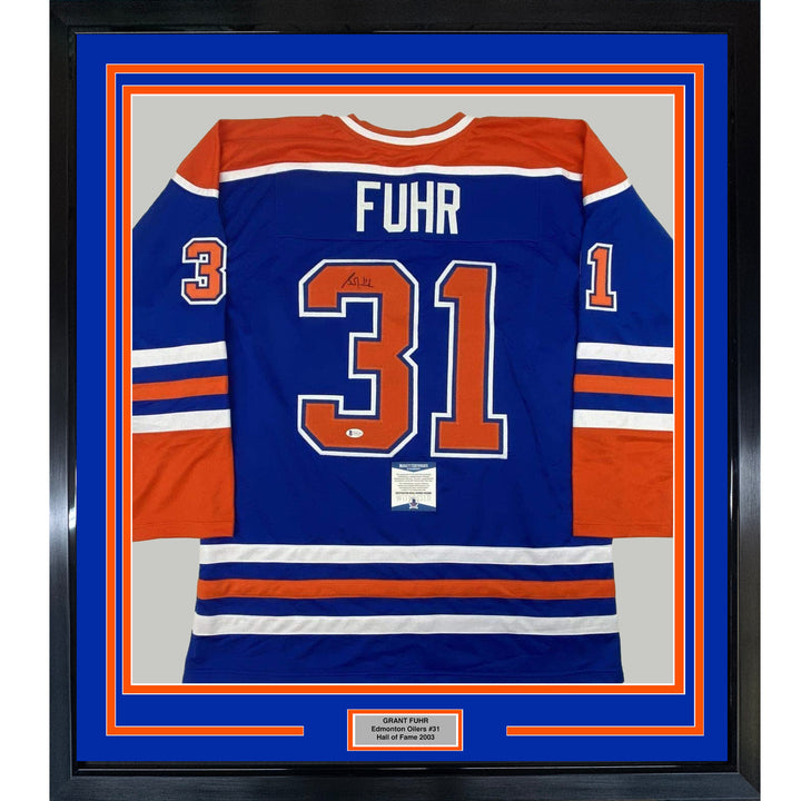 FRAMED Autographed/Signed GRANT FUHR 33x42 Edmonton Blue Jersey Beckett BAS COA