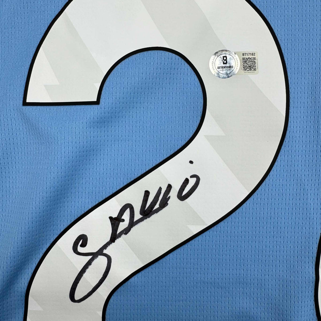 Autographed/Signed Savinho Manchester City Blue Soccer Jersey Beckett BAS COA
