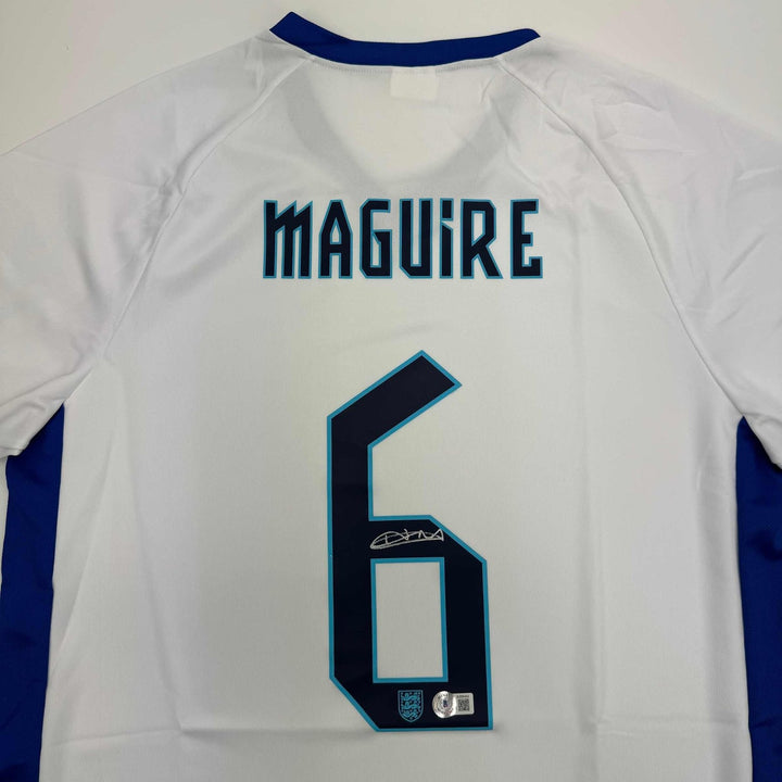Autographed/Signed Harry Maguire England White Jersey Beckett BAS COA