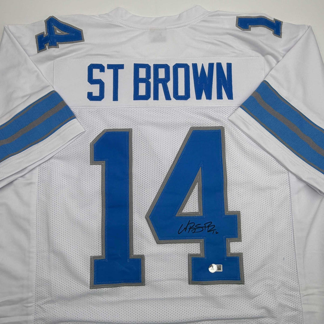 Autographed/Signed Amon-Ra St. Brown Detroit White Jersey Beckett BAS COA