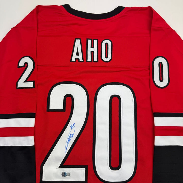 Autographed/Signed Sebastian Aho Carolina Red Hockey Jersey Beckett BAS COA