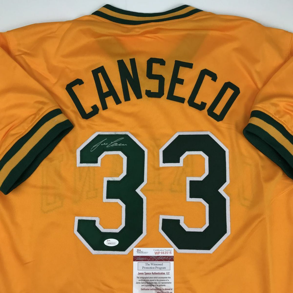 Autographed/Signed Jose Canseco Oakland Green Baseball Jersey JSA