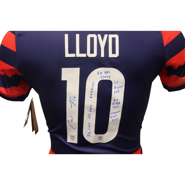 Carli Lloyd USWNT Autographed and Insc. w/ Full USWNT Career Stats Blue/Red Away Replica Jersey (CX Auth)
